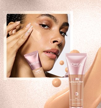 A woman applying concealor to face
